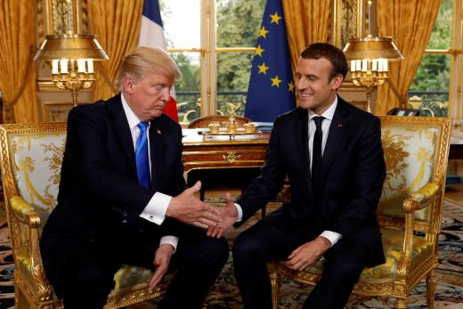French President Emmanuel Macron and US President Donald Trump shake hands at the Elysee Palace in Paris