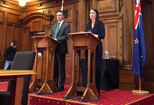 New Zealand's Prime Minister-designate Jacinda Ardern speaks as she stands next to New Zealand Green Party leader James Shaw in Wellington