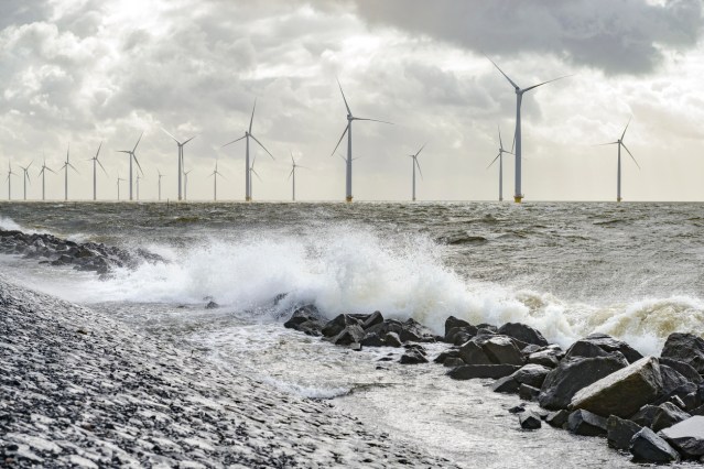 Wind turbines on land and offshore in a storm
