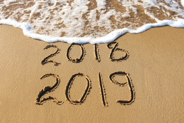 2019, 2018 Years Written On Sandy Beach Sea. Wave Washes Away 20