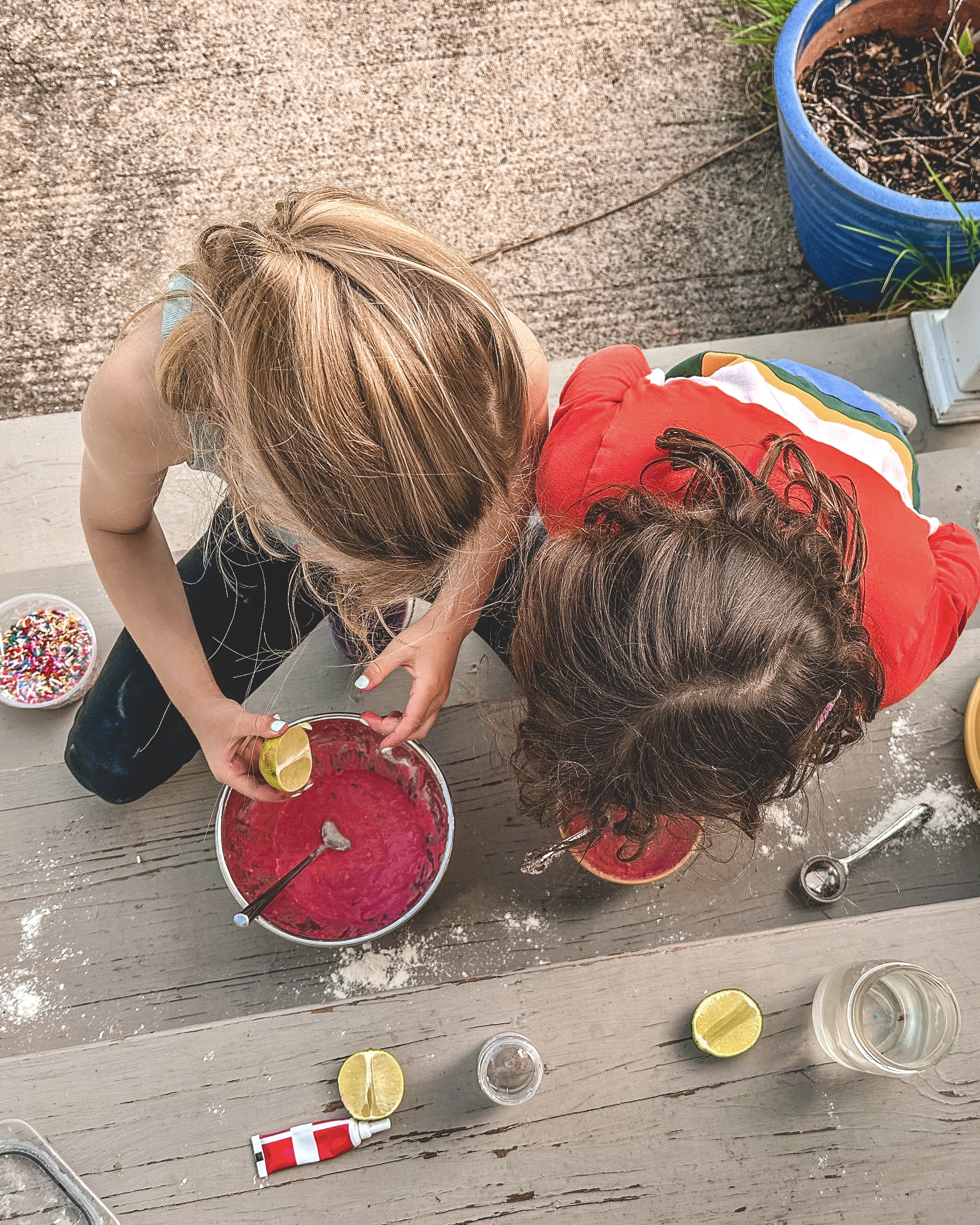 Bridget's daughter and a friend are having fun with potion play.