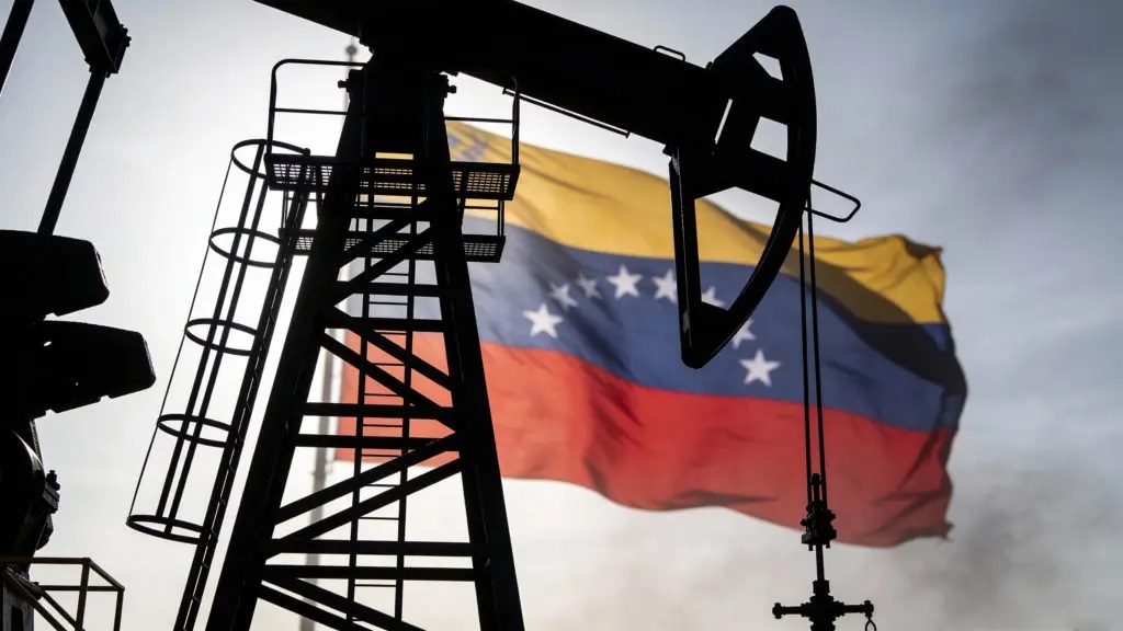 An oil rig with the Venezuelan flag in the background.