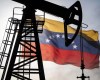 An oil rig with the Venezuelan flag in the background.