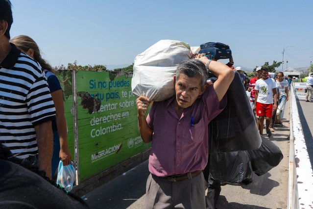 Venezuelan migrants cross the border into Colombia in February 2020, entering the city of Cúcuta.