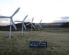 Greenpeace activists install a wind farm on a green of the Trump Turnberry Golf Club, together with a sign reading ‘Choose wind, dump Trump’.